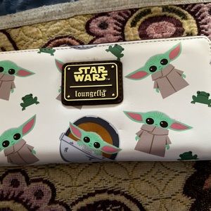 Brand new Mandalorian loungefly wallet. Original tag is still on it $45.